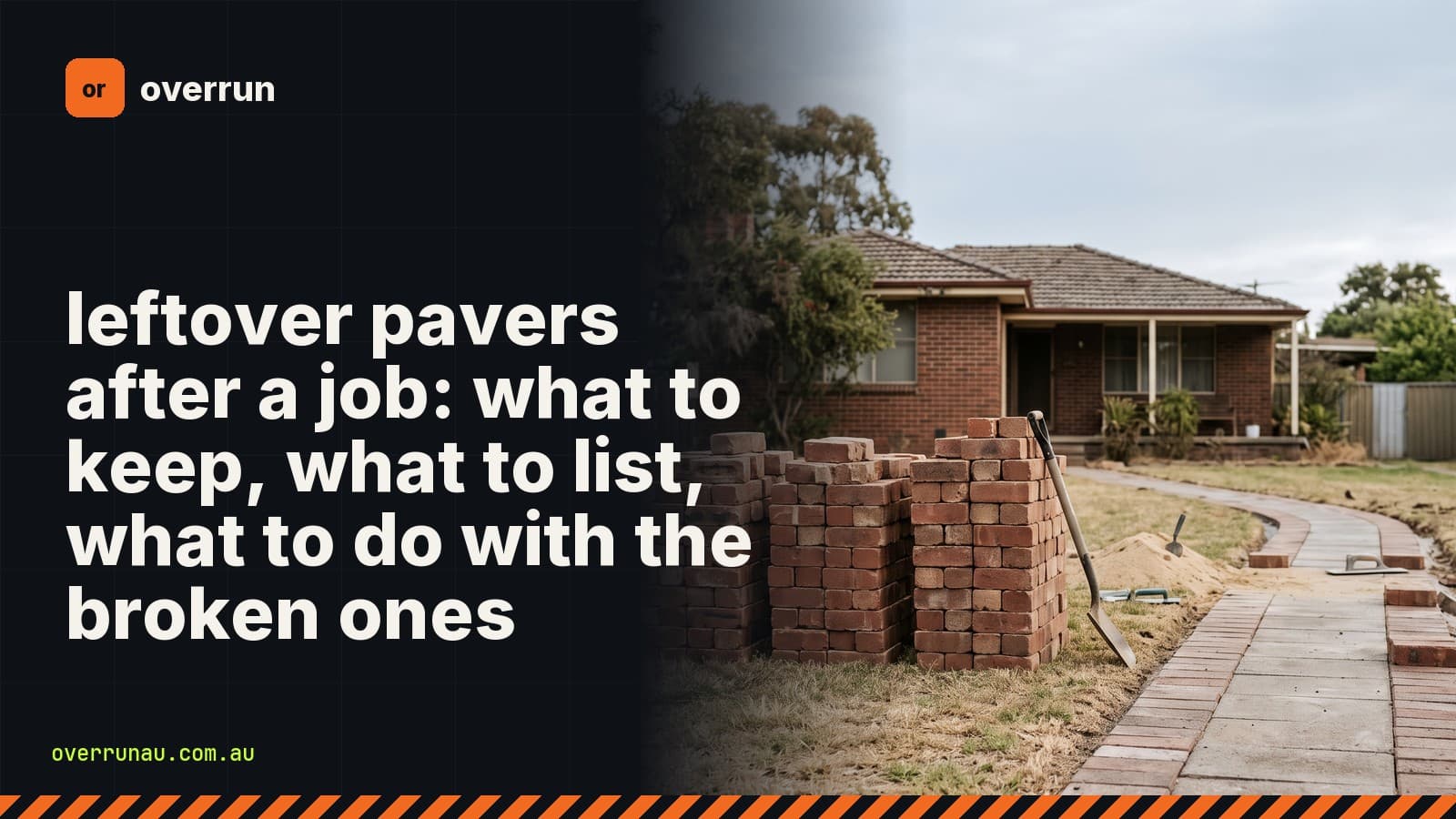 Stacks of leftover clay bricks and grey pavers on a front lawn beside a half-laid paver path leading to a brick house